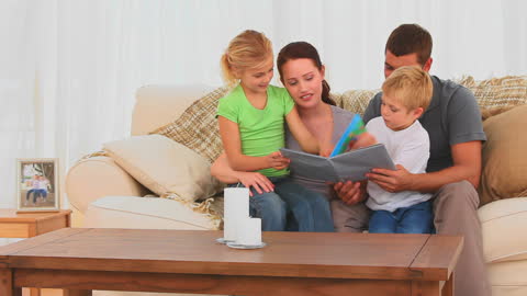 Family Bonding Moments With Book at Home