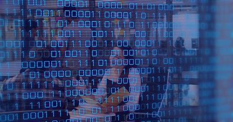 Female Manager Leading Tech Team Collaboration in Modern Office with Binary Code Overlay
