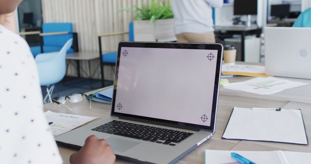 Person Using Laptop with Blank Screen in Office Environment - Download Free Stock Images Pikwizard.com