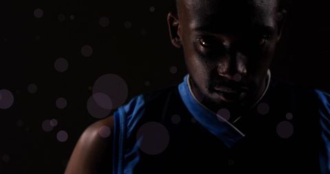 Pensive Athlete in Dim Light Contemplating Determination