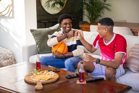 Diverse Friends Bonding Over Basketball and Pizza