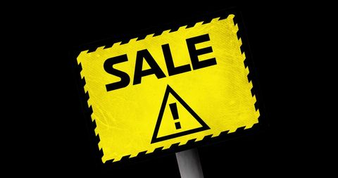 Yellow warning sale sign with exclamation mark for retail promotion