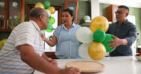 Diverse senior friends preparing for festive celebration