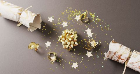 Festive christmas crackers and decorations on grey background