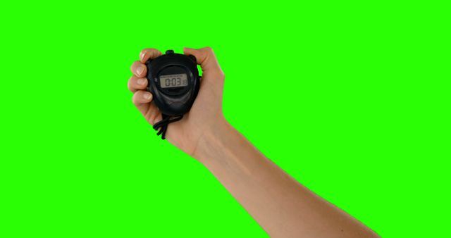 Close-up Hand Holding Stopwatch with Green Background - Download Free Stock Images Pikwizard.com