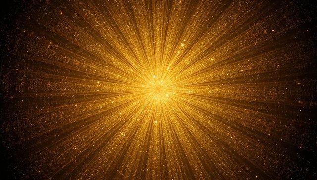 Golden starburst radiating light rays and sparkling particles for festive background