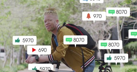 Albino man with social media notifications cycling in urban setting