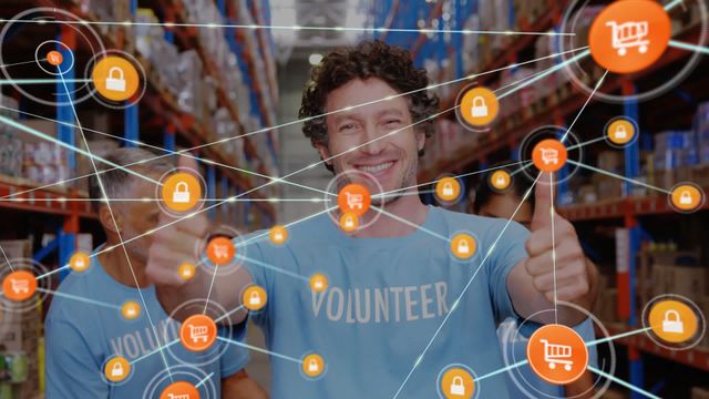 Caucasian male volunteer smiling and showing thumbs up inside a warehouse, with a digital network overlay of icons representing connectivity, shopping carts, and security locks. Perfect for promotions about volunteering, charity, donation drives, community service, and digital security initiatives in charitable organizations.