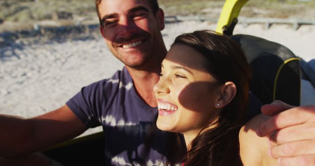 Happy caucasian couple sitting in beach buggy by the sea using smartphone taking selfies - Download Free Stock Photos Pikwizard.com