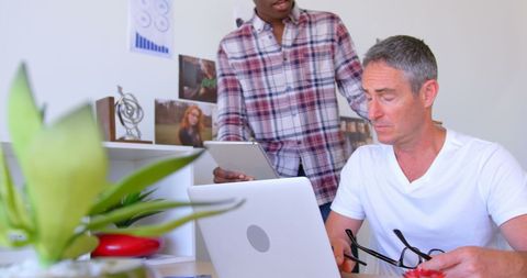 Collaborating on Project in Modern Office with Digital Devices