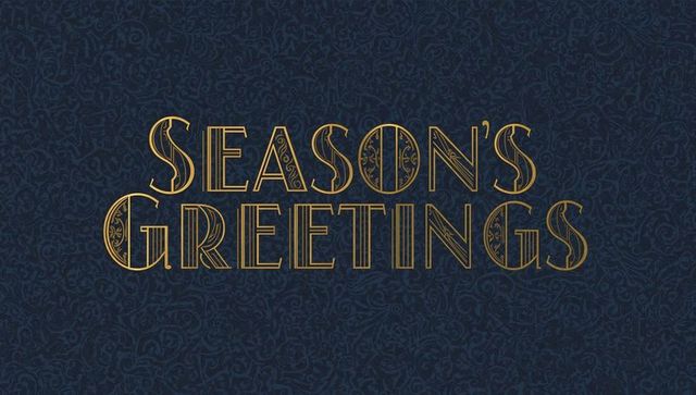 Season's greetings gold art deco typography on navy paisley background