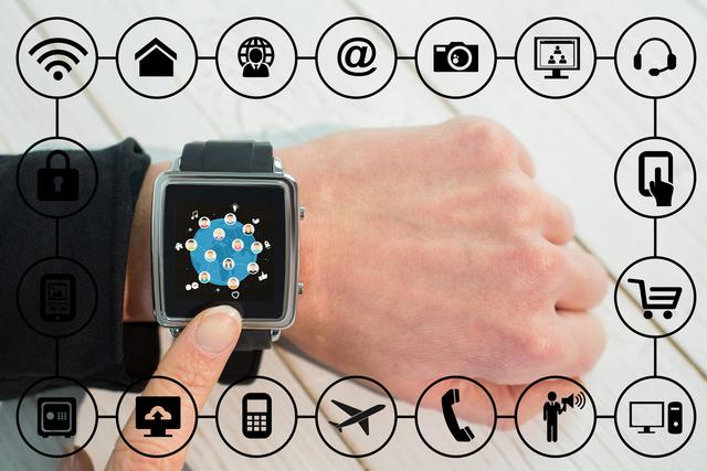 Close-up depiction of a smartwatch on wrist with various Internet of Things (IoT) related icons and graphics surrounding. Perfect for illustrating the concept of connected devices, modern technology, and the digital future. Can be used in articles, presentations, or marketing materials concerning tech advancements, communication technologies, and IoT solutions.