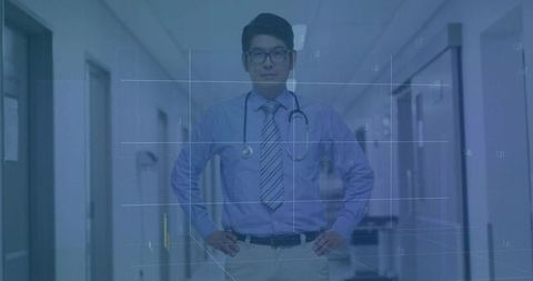 Confident Male Doctor in Hospital Corridor Wearing Eyeglasses