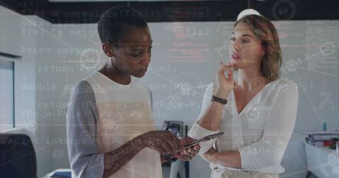 Diverse Coworkers Analyzing Financial Data on Tablet