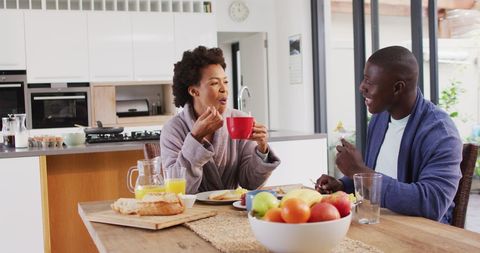 Happy Couple Enjoying Breakfast in Modern Kitchen - Download Free Stock Images Pikwizard.com