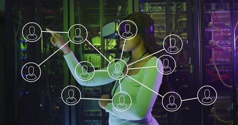 Professional woman engaging with virtual network in futuristic server room