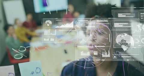 Man Analyzing Digital Data Overlays in Collaborative Meeting Room