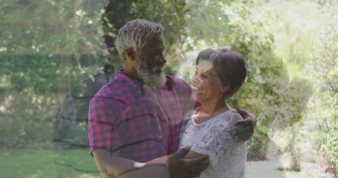 Senior Couple Embracing in a Sunlit Garden