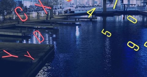 Neon numerals reflecting across harbor water with wooden piers and urban promenade at night