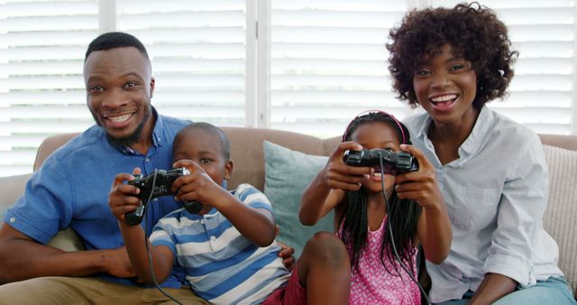Happy African American Family Enjoying Video Games Together in Living Room - Download Free Stock Images Pikwizard.com