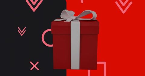 Red gift box with white satin ribbon on split black and red background for holiday design