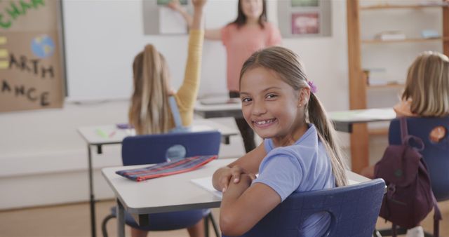 Happy Schoolgirl Engaged in Classroom Learning Activity with Teacher - Download Free Stock Images Pikwizard.com