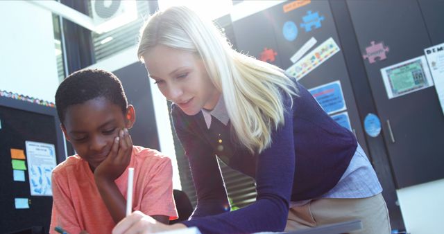 Teacher Assisting Young Student in Classroom Learning Activity - Download Free Stock Images Pikwizard.com