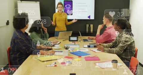 Woman presenting while team analyzing social media metrics in modern conference room