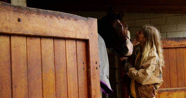 Young Woman Cuddling Her Horse in Stable - Download Free Stock Images Pikwizard.com