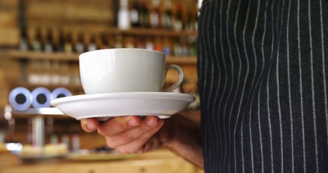 Barista Holding Coffee Cup in Cozy Café - Download Free Stock Images Pikwizard.com