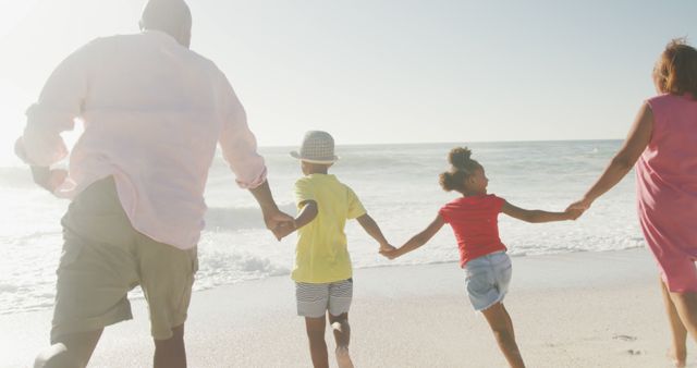 African American Family Holding Hands at Beach - Download Free Stock Images Pikwizard.com