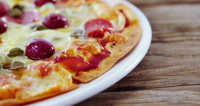 Close-Up of Delicious Pepperoni Pizza with Olives and Melted Cheese - Download Free Stock Images Pikwizard.com