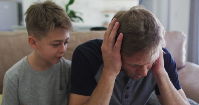 Worried Boy Comforting Stressed Father at Home - Download Free Stock Images Pikwizard.com