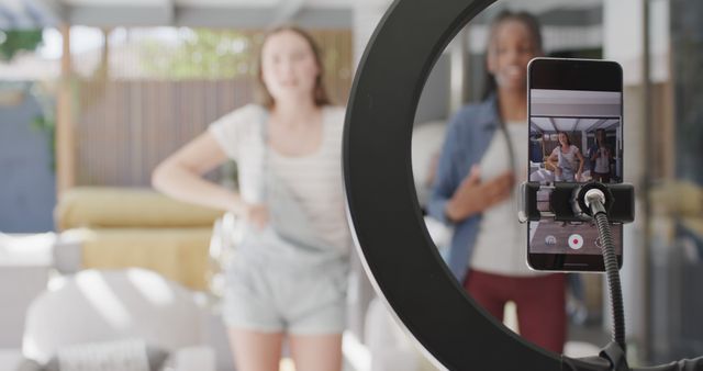 Two Teenage Friends Recording Dance Video on Smartphone with Ring Light - Download Free Stock Images Pikwizard.com