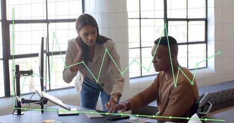 Collaborative team analyzing data on tablet with interactive analytics overlay in office