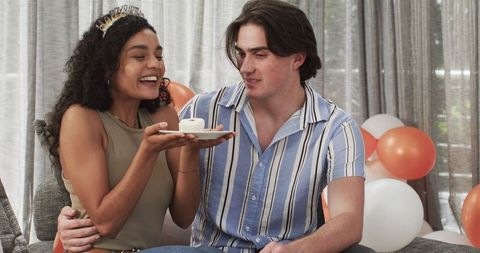 Smiling Couple Celebrating Birthday in Cozy Home Setting