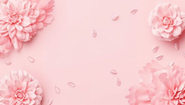 Framing delicate pink layered blooms around empty center on soft pastel pink background