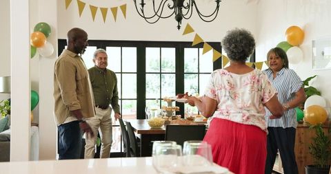 Senior Group Celebrating Retirement Party Together Indoors