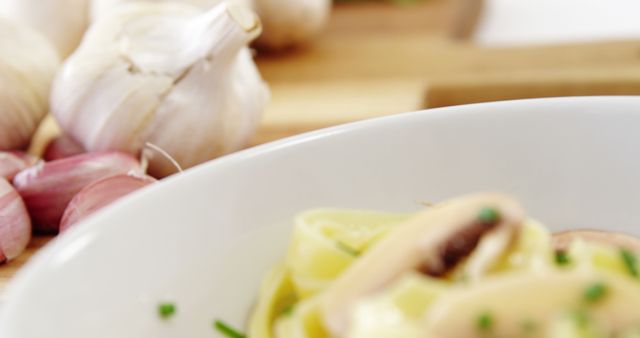 Close-up of Creamy Mushroom Pasta With Fresh Garlic - Download Free Stock Images Pikwizard.com