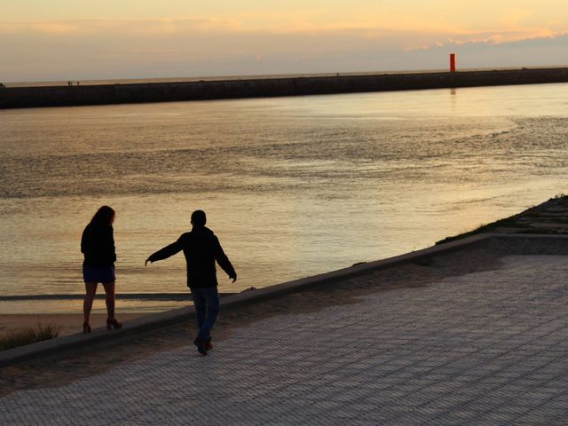 Couple enjoying a quiet walk by the beach during sunset. The serene setting captures the tranquility and romance of an evening by the ocean. Perfect for themes of love, connection, leisure, and natural beauty. Can be used for advertisements, romantic cards, lifestyle blogs, travel promotions, and relaxation content.