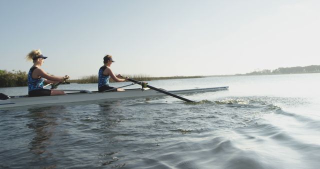 Women Rowing in Calm Lake during Day - Download Free Stock Images Pikwizard.com