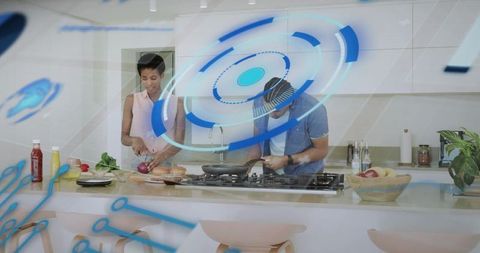 Friends cooking with augmented reality interface in modern kitchen chopping stirring