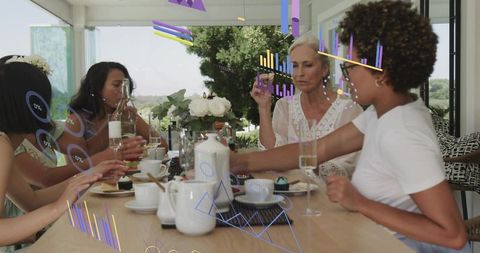 Multigenerational women sharing tea and pastries on veranda with ar data overlays