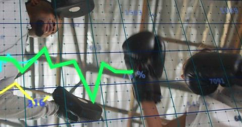 Coach Holding Focus Mitts, Boxer Sparring with Performance Data Overlay