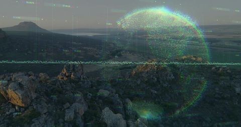 Holographic data globe overlaying rugged rocky landscape for tech and earth visuals