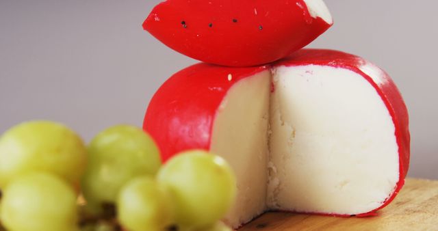 Round Soft Cheese with Red Wax Rind and Green Grapes - Download Free Stock Images Pikwizard.com