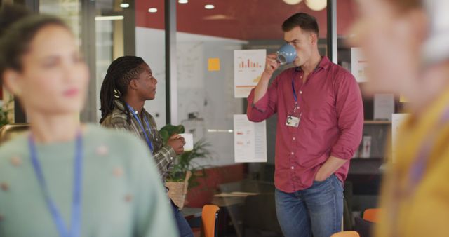 Coworkers Having a Casual Chat and Drinking Coffee in Modern Office - Download Free Stock Images Pikwizard.com