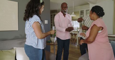 Seniors Enjoying Lively Celebration with Friends at Home