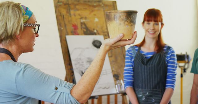 Pottery Teacher Demonstrating Technique in Art Class - Download Free Stock Images Pikwizard.com