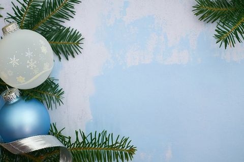 Festive Christmas Background with Ornaments and Evergreen Branches